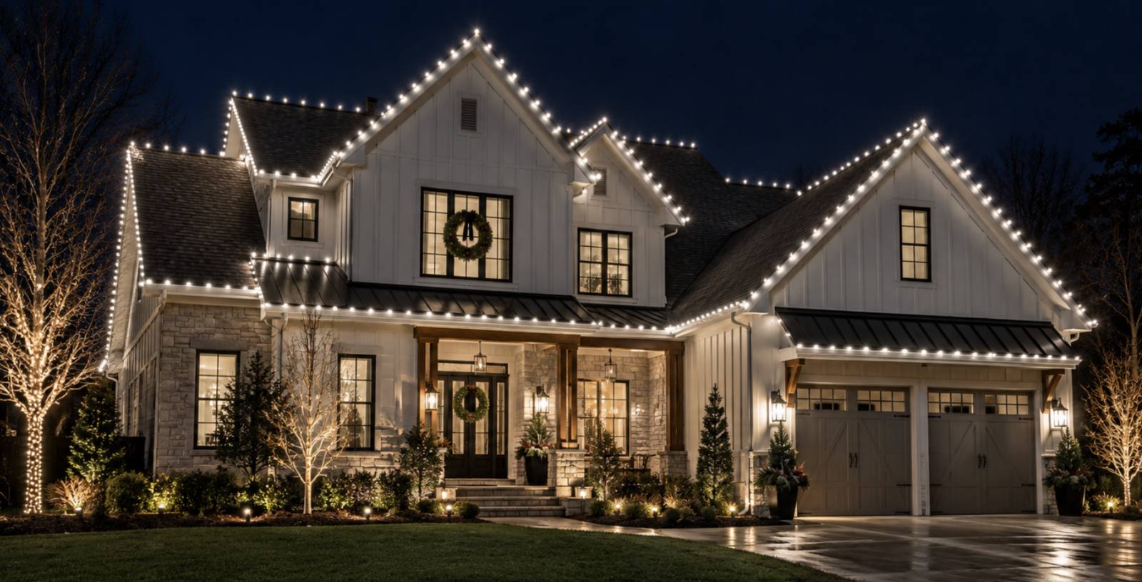 Warm white roofline lighting on a modern farmhouse-style home