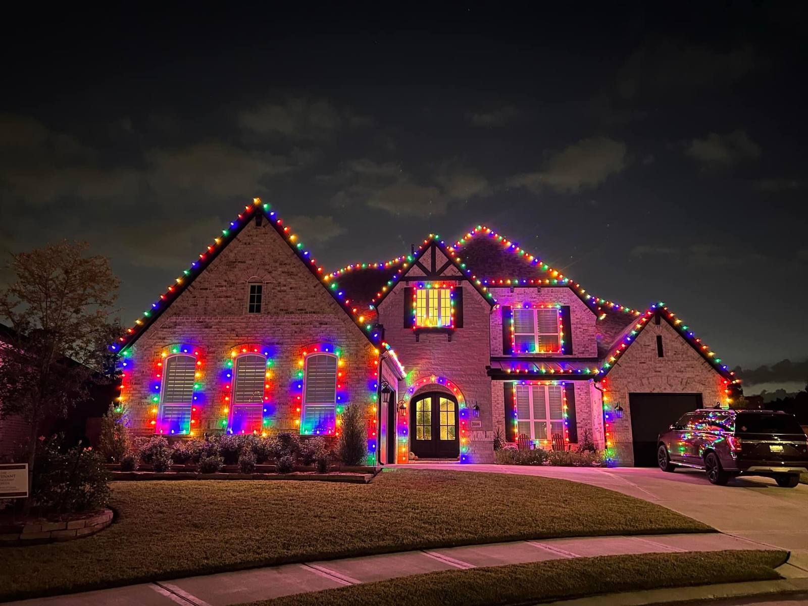 Full multicolor C9 lighting covering a home's roofline and windows